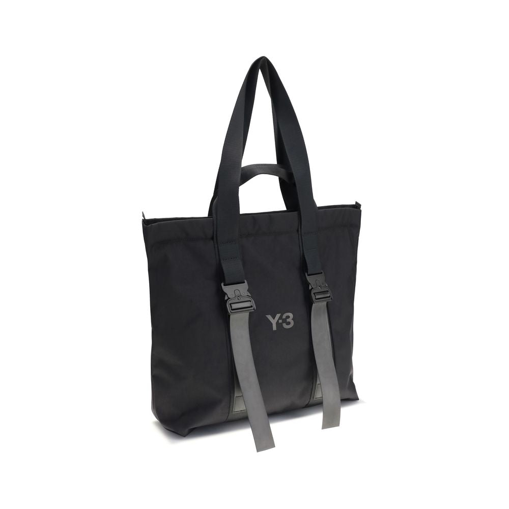 Y-3 Black Nylon Shoulder Bag with tone-on-tone logo, top handles, and zippered closure, ideal for organized storage and secure portability.