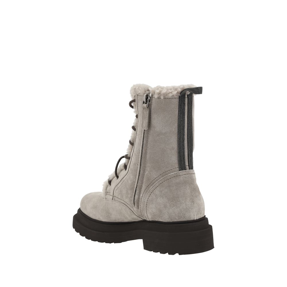 Side view of Brunello Cucinelli Gray Rubber Lace-Up Boots with suede design and fur-lined interior.