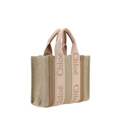 Elegant Chloé Beige Linen Handbag with leather details, featuring double handles and adjustable shoulder strap for versatile carrying.