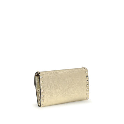 Valentino Garavani Gold Calf Leather Bos Taurus Wallet with iconic Rockstud design and removable chain for versatile style.
