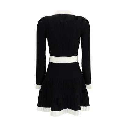 Balmain Black Viscose Casual Dress with flared skirt and embossed buttons, rear view, showcasing the elegant ribbed trim and feminine silhouette.