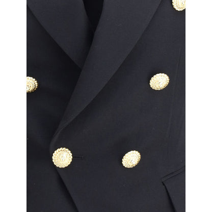 Close-up of Balmain Black Wool Blazer with embossed gold buttons and wide peaked lapels, highlighting iconic design elements.
