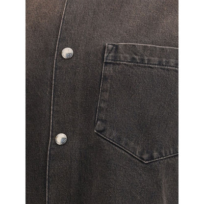 Close-up of 7FOR Black Cotton Denim Jacket showing front button closure and patch pocket, emphasizing its casual and versatile style.