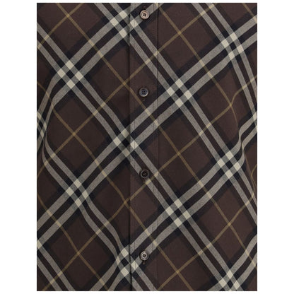 Close-up of Burberry Brown Cotton Pattern Shirt featuring classic check design, button-down front, and soft flannel material.