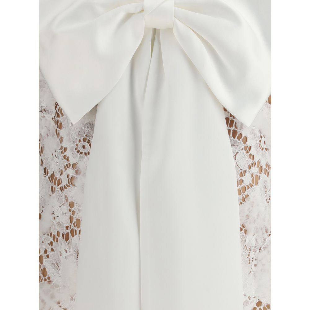 Self-Portrait White Nylon Casual Dress with lace bow and U-shaped back neckline, featuring an oversized dramatic bow detail.
