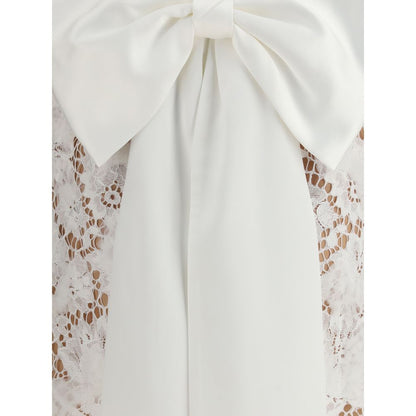 Self-Portrait White Nylon Casual Dress with lace bow and U-shaped back neckline, featuring an oversized dramatic bow detail.
