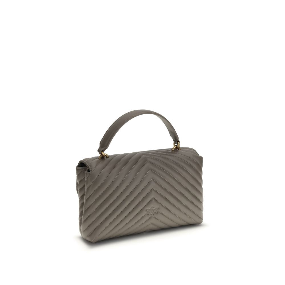 Front view with bag zipped and handles upright.