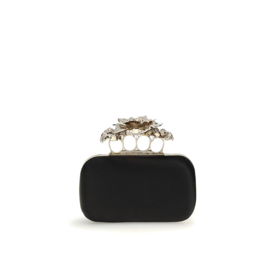 Alexander McQueen Black Silk Clutch Bag with crystal carnation knuckle handle and gold chain, elegant AW25 accessory.