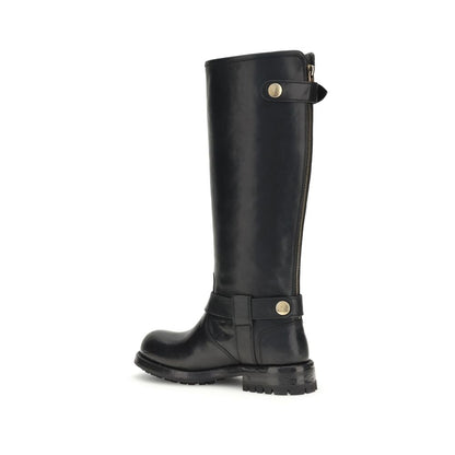 Dolce & Gabbana Black Calf Leather Bos Taurus Lace-Up Boots with buckle detail and durable TPU sole, side view.