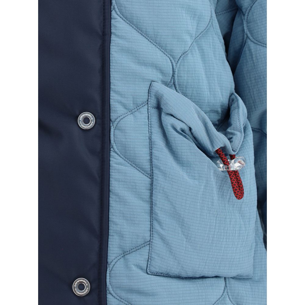 Close-up of MARBELL Light Blue Polyamide Coat showing quilted design, button details, and contrasting shoulder with pocket feature.