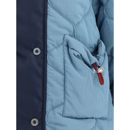 Close-up of MARBELL Light Blue Polyamide Coat showing quilted design, button details, and contrasting shoulder with pocket feature.