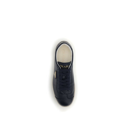 Top view of Prada Blue Calf Leather Bos Taurus Low Top Sneakers with embossed logo and iconic triangle.