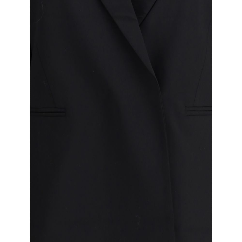 Di Stavnitser Black Polyester Blazer with peaked lapels and concealed button closure, showcasing contemporary elegance.