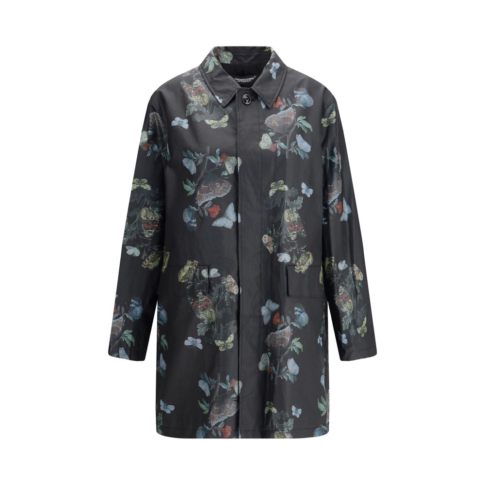 Undercover Black Cotton Coat - Waxed cotton raincoat with floral pattern, front flap pockets, and cotton lining, perfect for AW25 season.