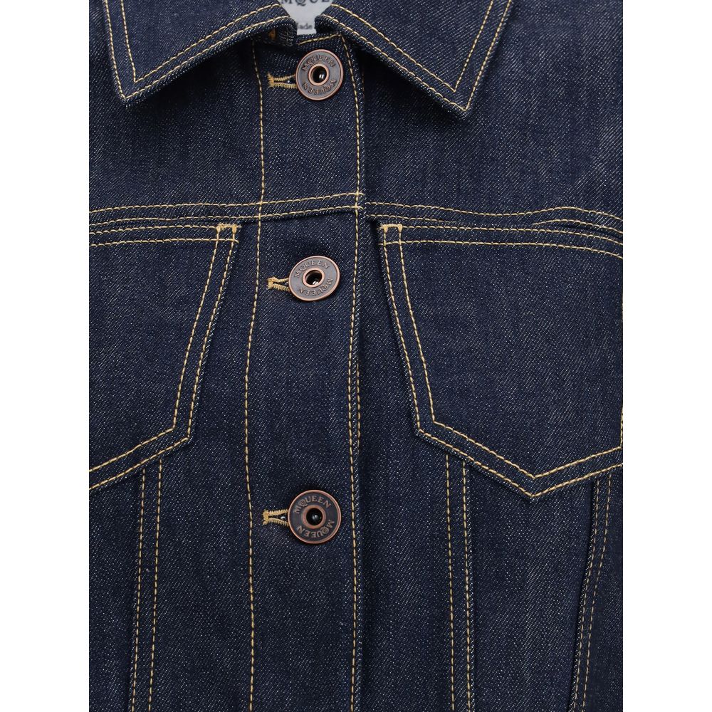 Close-up of Alexander McQueen Blue Cotton Denim Jacket with contrast stitching, pointed shoulders, and front button closure, AW25.