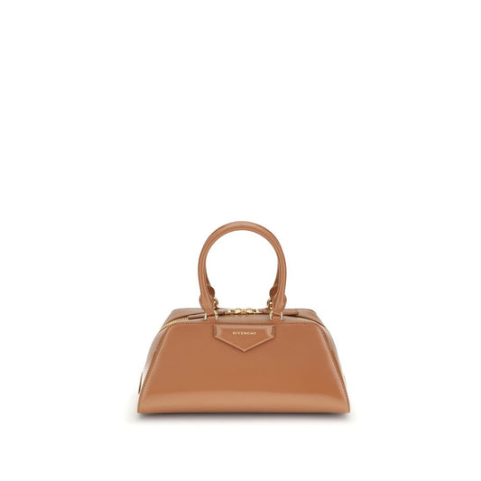 Givenchy Brown Calf Leather Bos Taurus Handbag with elegant design and embossed logo. Featuring structured silhouette and adjustable strap.