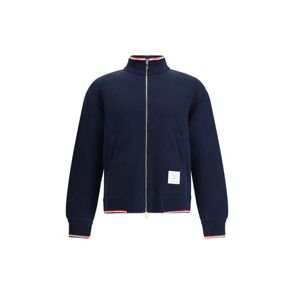 Thom Browne Blue Cotton Bomber with front zip and tricolor accents, featuring a logo patch, perfect for modern and refined fall fashion.