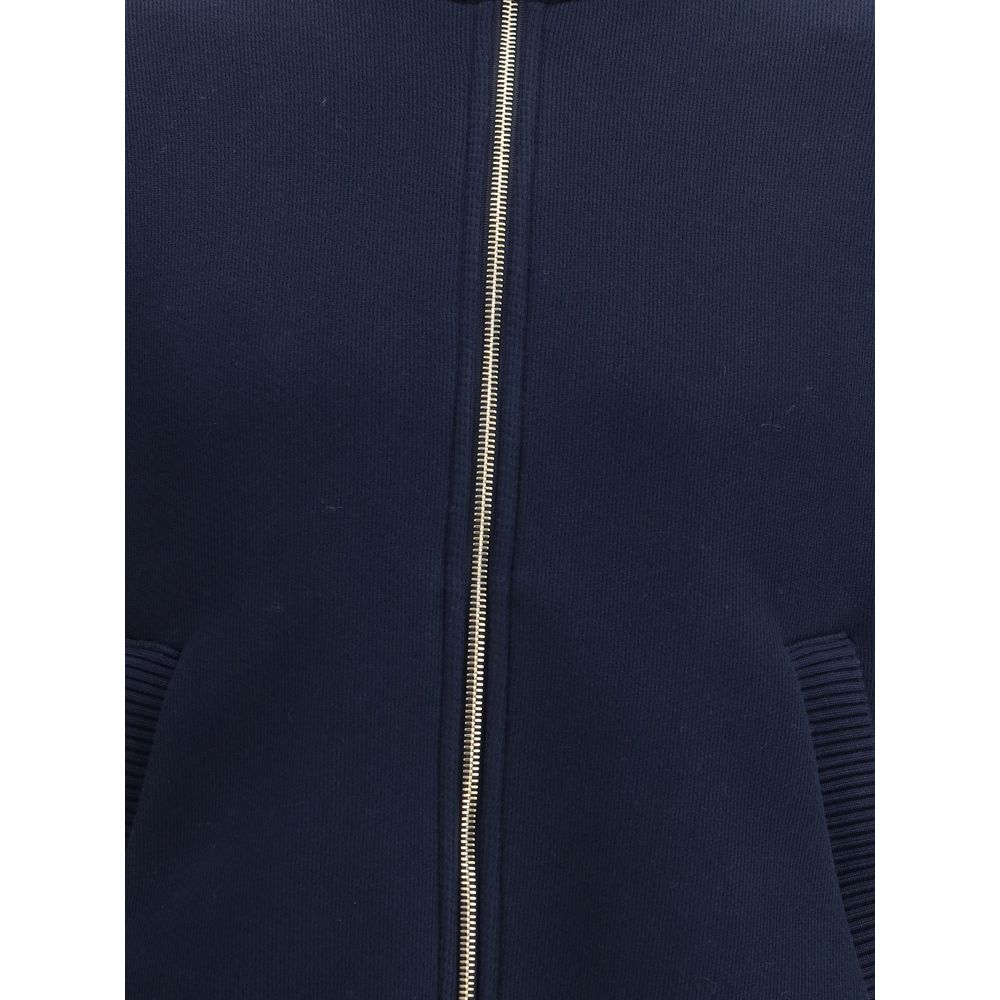 Close-up of Thom Browne Blue Cotton Bomber jacket with front zip closure and distinctive design details.