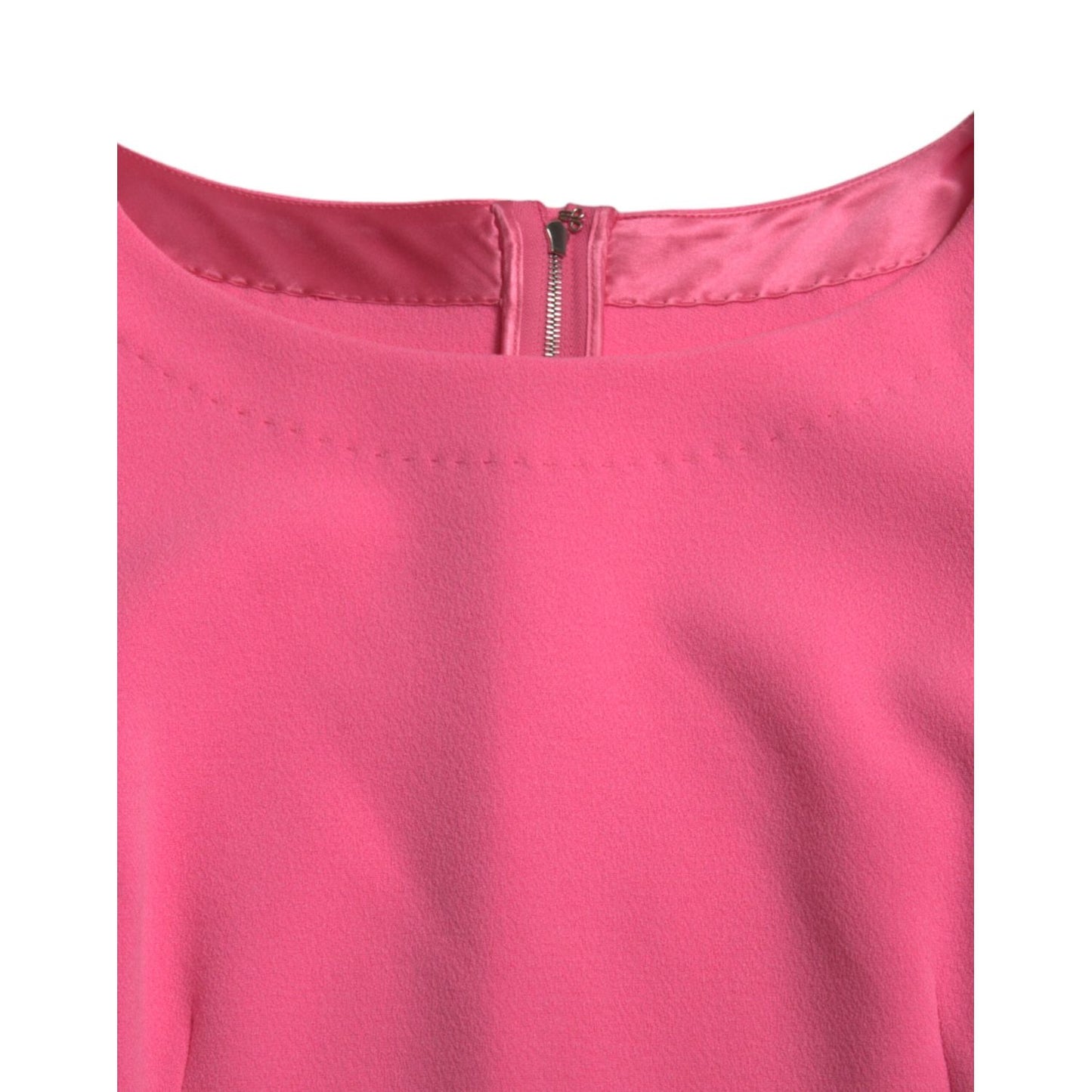 Close-up of Dolce & Gabbana Pink Polyester Long Sleeves Sheath Midi Dress showing neckline and back zipper.