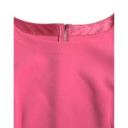 Close-up of Dolce & Gabbana Pink Polyester Long Sleeves Sheath Midi Dress showing neckline and back zipper.