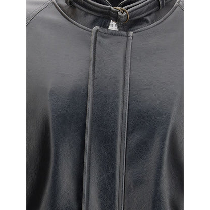 Close-up of MM6 Black Polyester Bomber with stand collar and buckle detail, showcasing tone-on-tone stitching on smooth fabric.