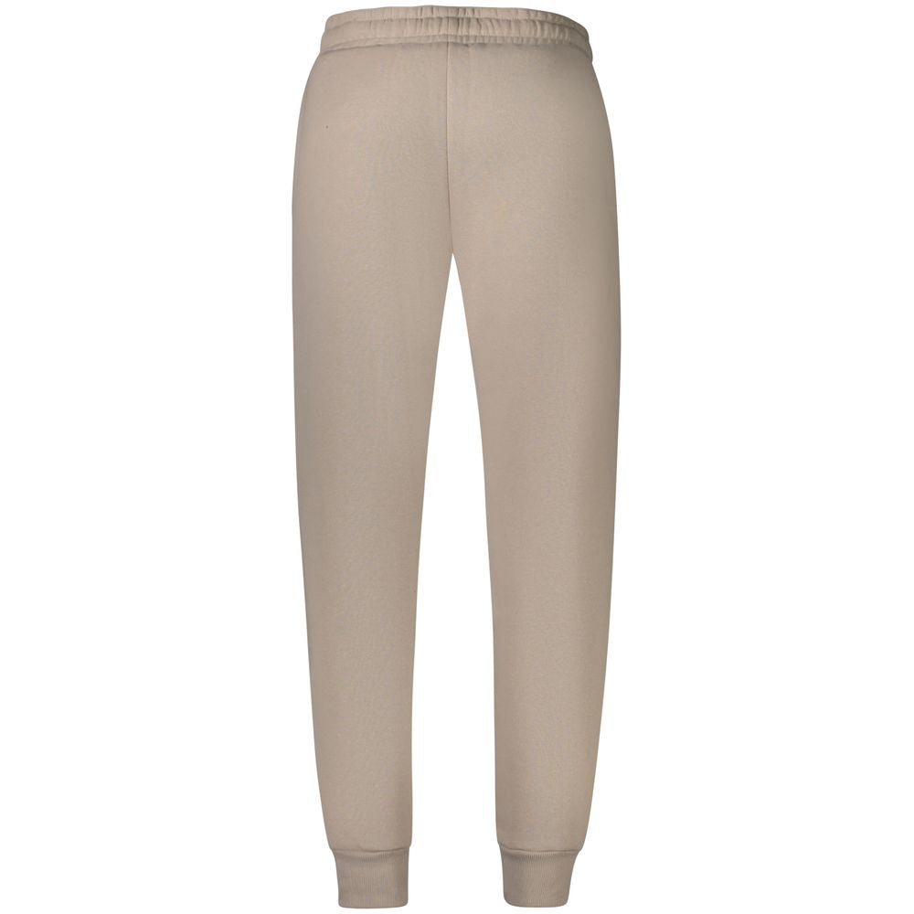 Alt Tag: Norway 1963 Beige Cotton Pant with fleece fabric, elastic waist and ankle cuff, featuring 2 pockets and logo embroidery.