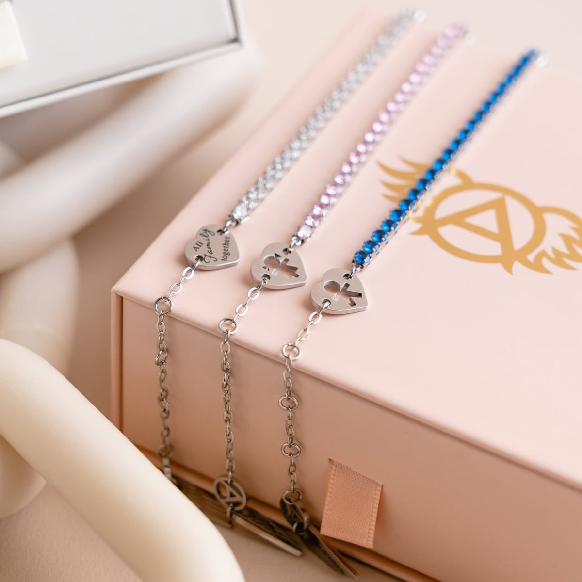 AN JEWELS JEWELRY Mod. AL.BLIYMBL bracelets on display box with heart charms and sparkling design.