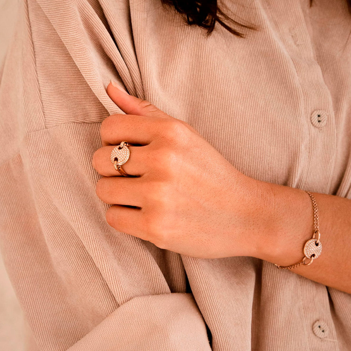 Woman wearing AN JEWELS JEWELRY Mod. AL.RJT01RC-8 bracelet and ring, showcasing elegant design and craftsmanship.