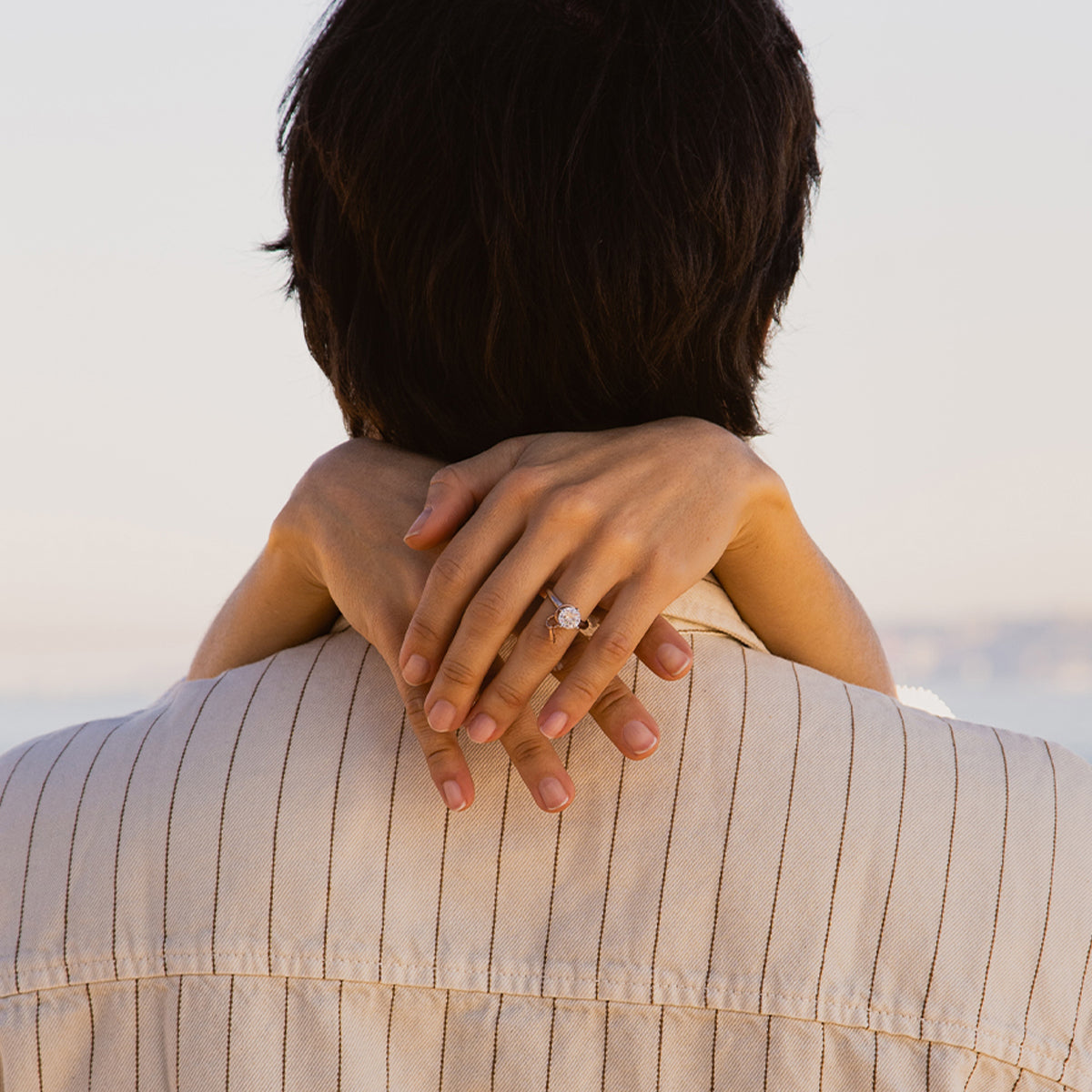 Couple embrace with woman wearing AN JEWELS JEWELRY Mod. AL.RLFY01-9 ring