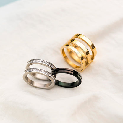 Stylish rings collection from AN JEWELS JEWELRY Mod. AR.R3NS02Y-8 featuring gold, silver, and black finishes with crystal accents.
