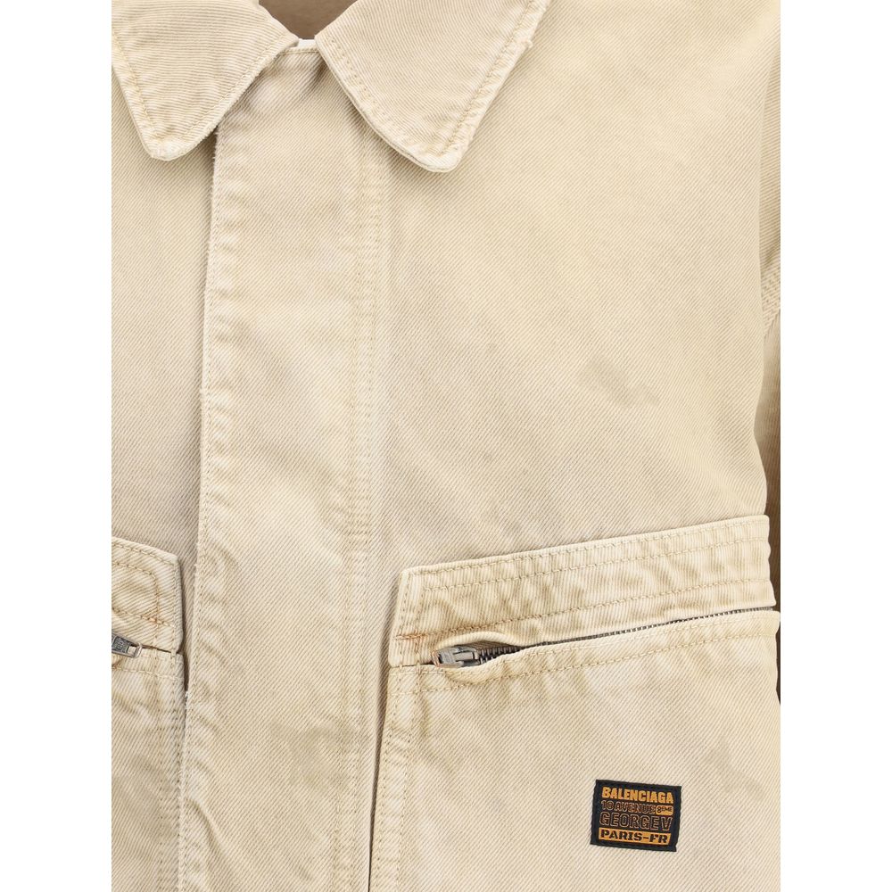 Close-up of Balenciaga Beige Cotton Denim Jacket featuring collar and logo patch.