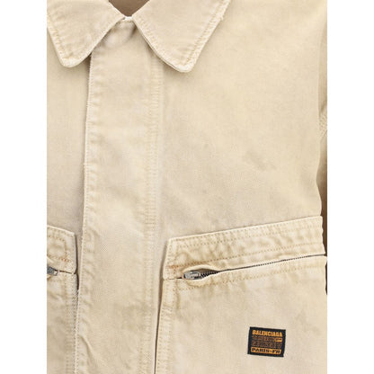 Close-up of Balenciaga Beige Cotton Denim Jacket featuring collar and logo patch.