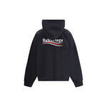 Back view of Balenciaga Logoed Hoodie with iconic monogram on oversized cotton fit, ribbed cuffs and hem. Streetwear style.