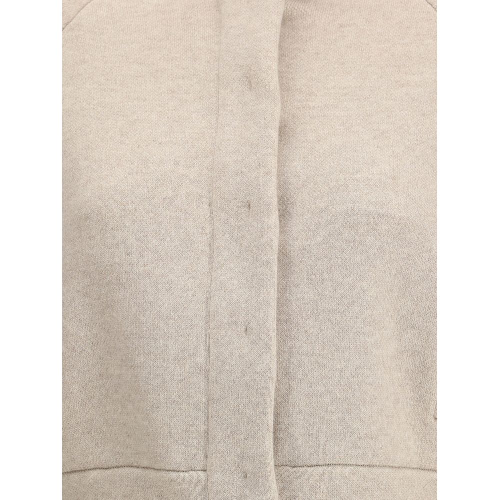 Close-up of Brunello Cucinelli Beige Cashmere Clothing featuring button and zipper closure and modern style.