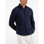 Man wearing Brunello Cucinelli Shirts Blue, silk and cotton blend, with long sleeves and buttoned cuffs.