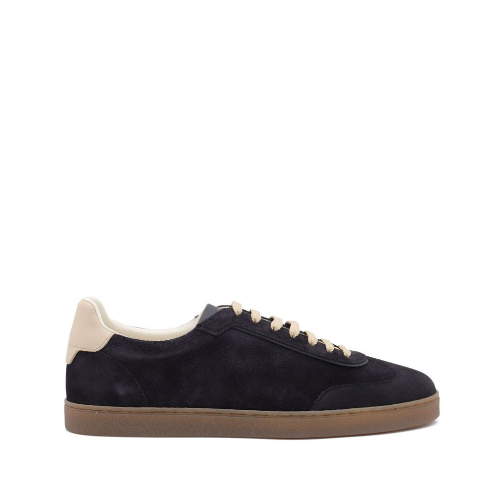 Brunello Cucinelli Suede sneakers with dark blue suede upper, leather detail, flat laces, rubber sole, and round toe.