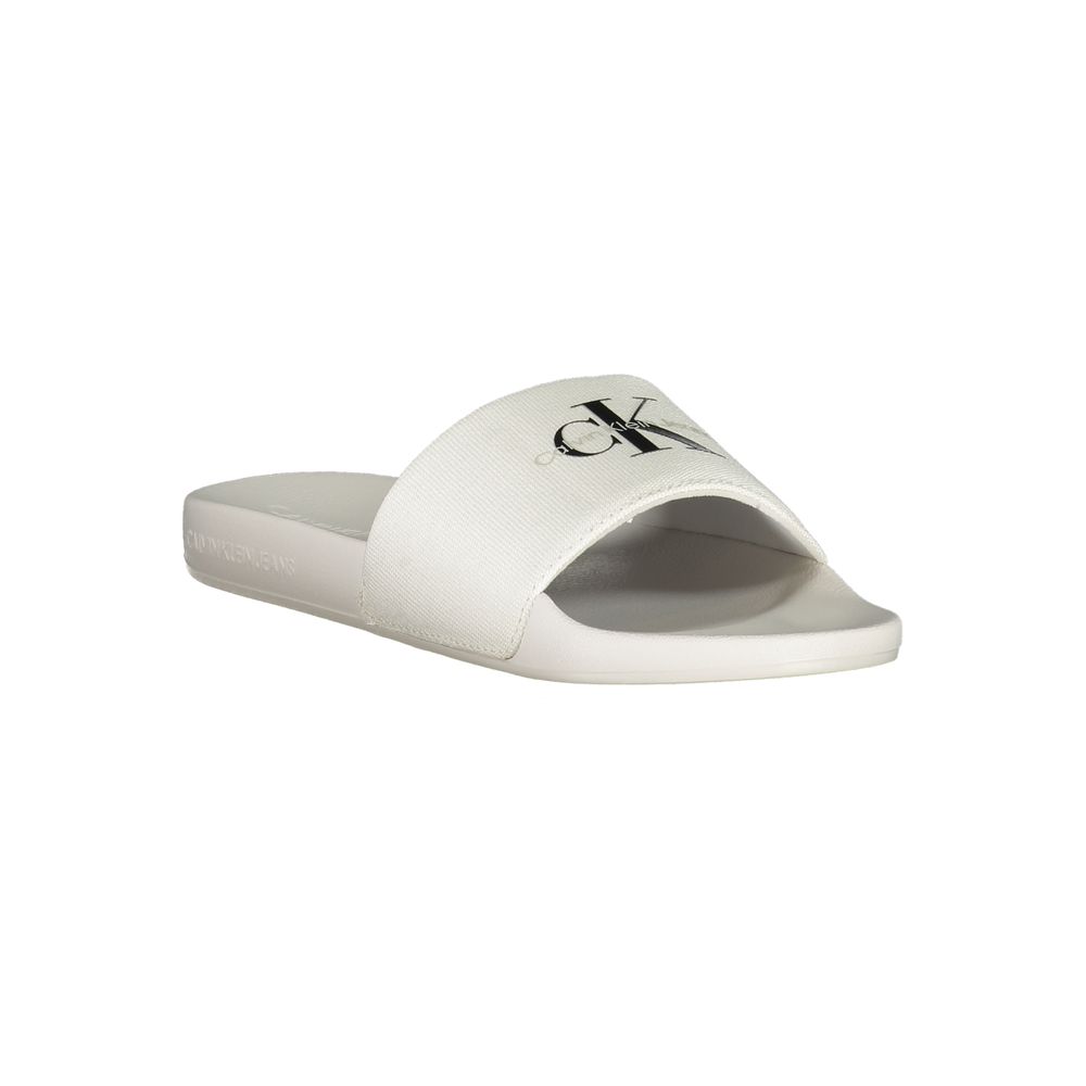 Calvin Klein White Polyester Women Sandal featuring logo-print design, ideal for poolside elegance and casual city strolls.
