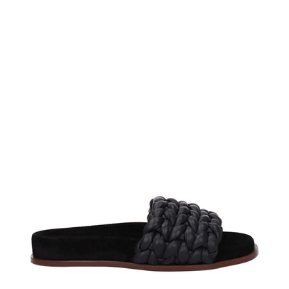 Chloé Black Leather Slippers with open toe and low flat heel, designed for casual style, featuring braided leather strap on brown sole.