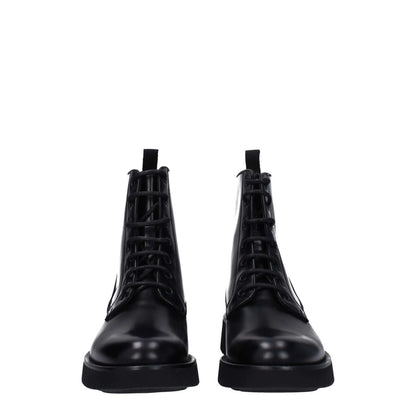 Church's Black Leather Ankle Boots with lace-up closure, round toe, and rubber sole. Features an aged and vintage effect design.