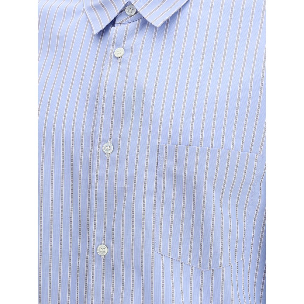 Comme Des Garçons Light Blue Cotton Pattern Shirt with subtle stripes and double cuffs, featuring a refined and contemporary design.