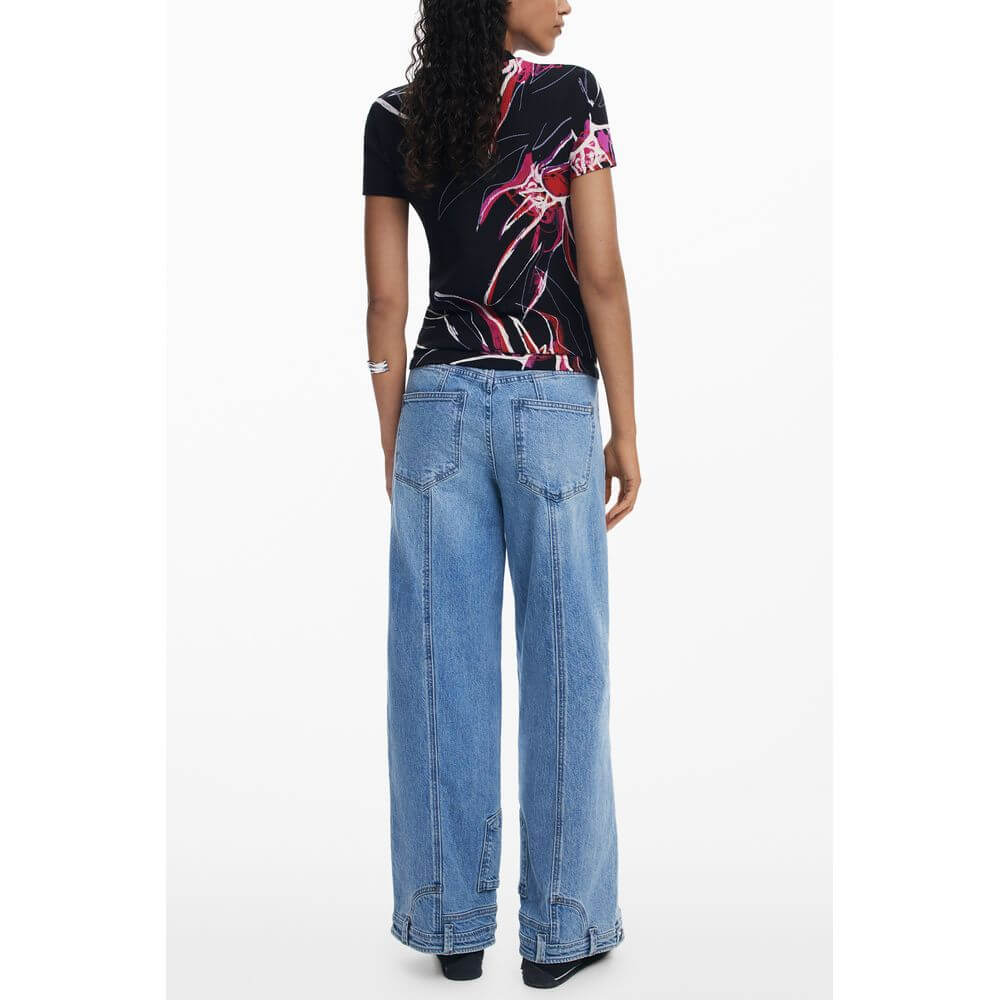 Desigual Black Viscose Women Top with bold print, back view, paired with wide-leg jeans for a stylish look.
