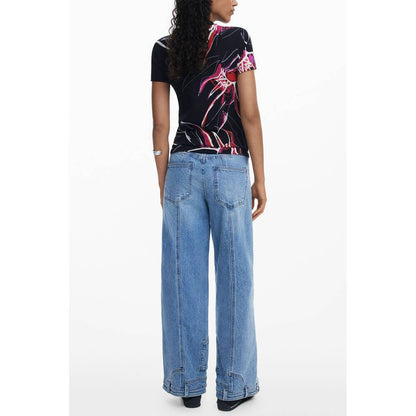Desigual Black Viscose Women Top with bold print, back view, paired with wide-leg jeans for a stylish look.