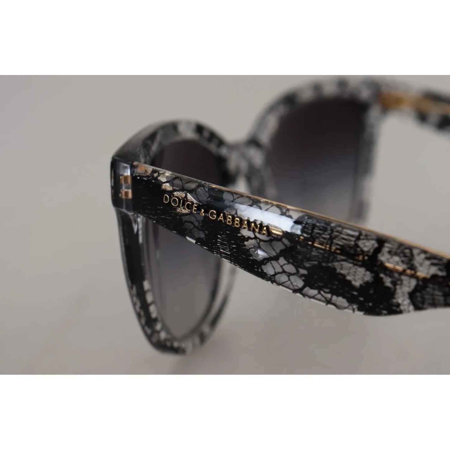 Dolce & Gabbana DG4190 Black Lace Acetate Crystal Round Sunglasses with gray gradient lenses for women, showcasing detailed side view.