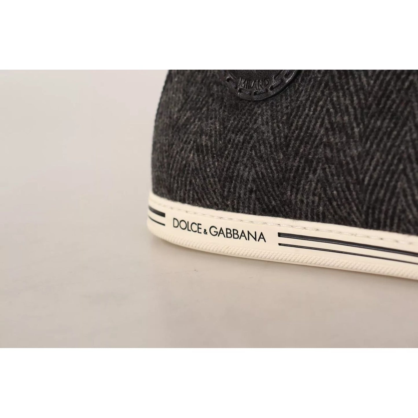 Close-up of Dolce & Gabbana Gray Wool Cotton Casual High Top Sneakers showing logo detail on rubber sole.