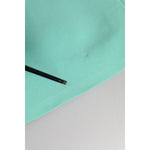 Close-up of Dolce & Gabbana Green Viscose Sleeveless Sheath Midi Dress fabric detail showing texture.