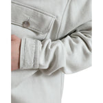 Close-up of Dolce & Gabbana Grey Cotton Button Down Collared Coat Jacket featuring detailed button and pocket stitching.