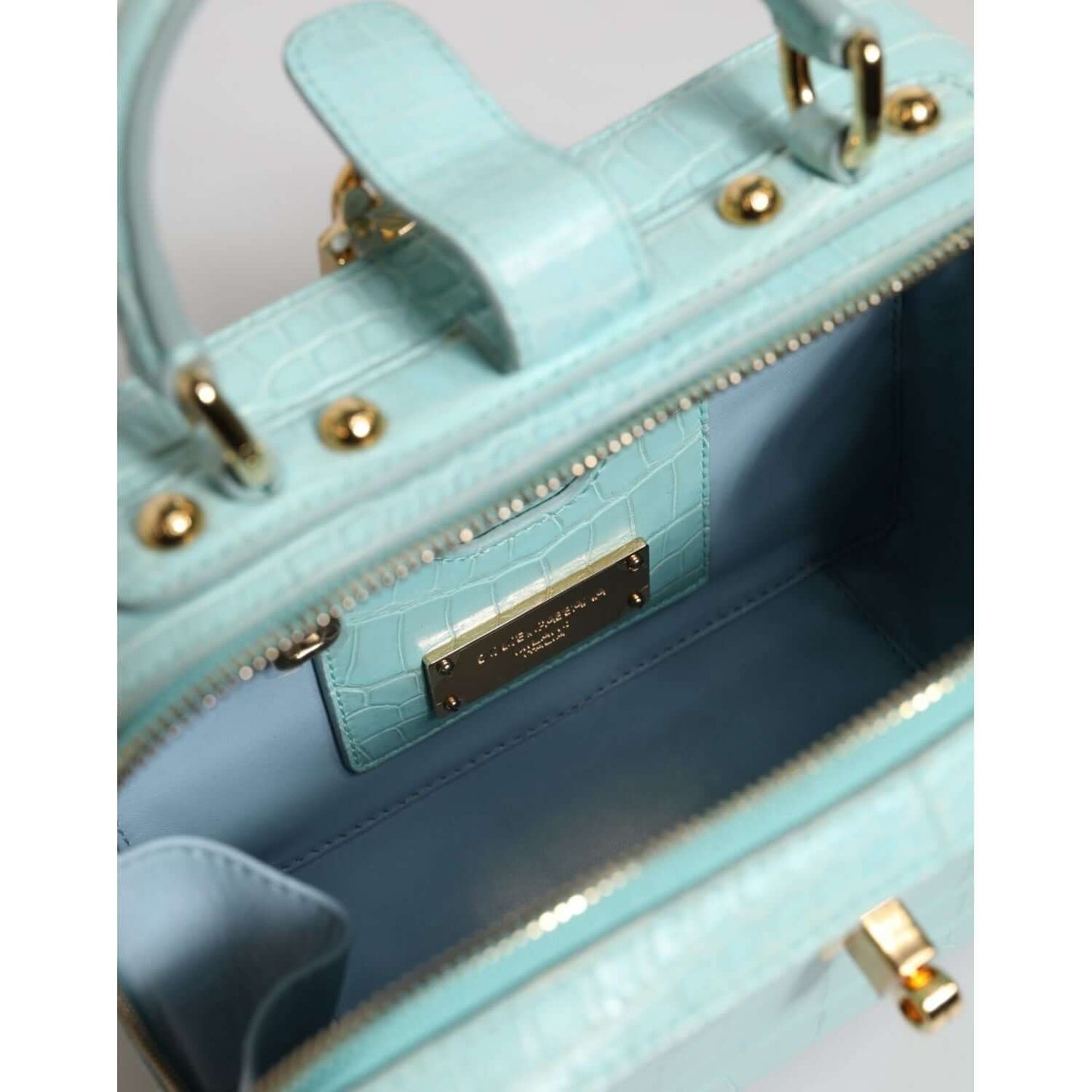 Dolce & Gabbana Mint Green Embossed Leather Padlock Shoulder Bag with blue lining, gold hardware, and adjustable strap.