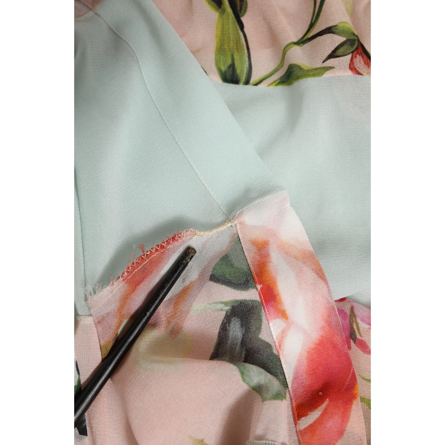 Close-up of Dolce & Gabbana Multicolor Floral Patchwork Ascot Collar Top fabric detail with vibrant floral prints.
