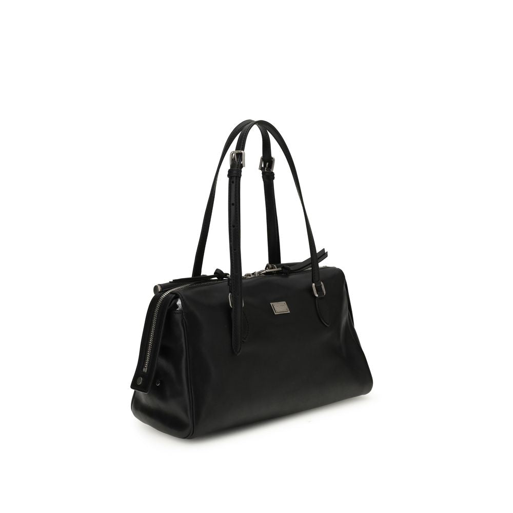 Front view with bag zipped and handles upright.