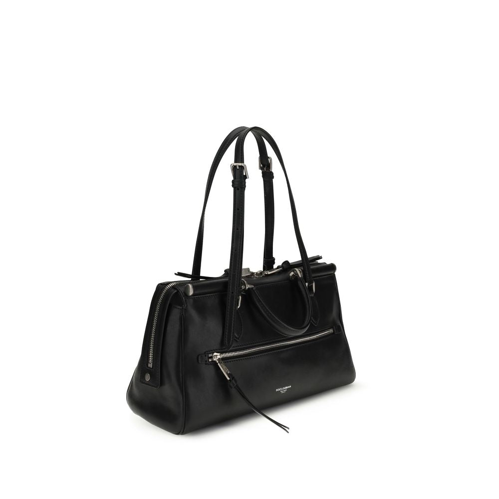 Front view with bag zipped and handles upright.